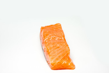 A large pink salmon fillet isolated on a white background
