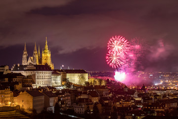 Fireworks over the Old Town of Prague, Czech Republic. New Year fireworks in Prague, Czechia. Prague fireworks during New Year Celebration near St. Vitus Cathedral, Prague, Czech republic.
