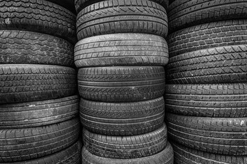 Old and used car tires. Background. Black and white.