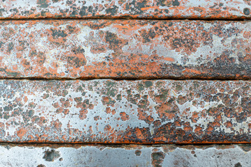 Polished metal surface with traces of corrosion.