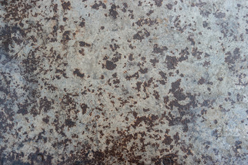 Polished metal surface with traces of corrosion.