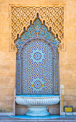 Amazing moroccan style fountain with fine colorful mosaic tiles at the Mohammed V mausoleum in...