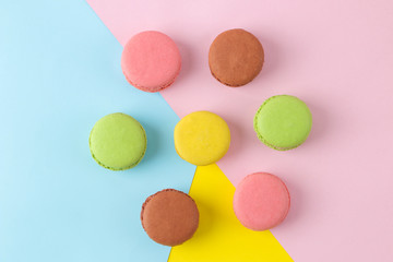 Macarons. french multicolored macaroons cakes. small french sweet cake on a bright multi-colored background. Dessert. Sweets. top view