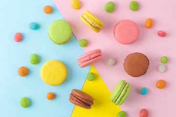 Macarons. french multicolored macaroons cakes. small french sweet cake on a bright multi-colored background. Dessert. Sweets. top view
