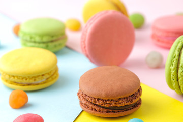 Fototapeta na wymiar Macarons. french multicolored macaroons cakes. small french sweet cake on a bright multi-colored background. Dessert. Sweets.
