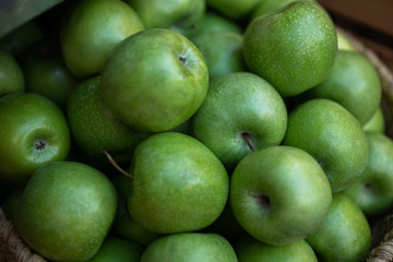 Fresh and organic fruits at farmers market. Ripe organic apples in a basket. Freshly, seasonal harvested fruits. Agriculture products.