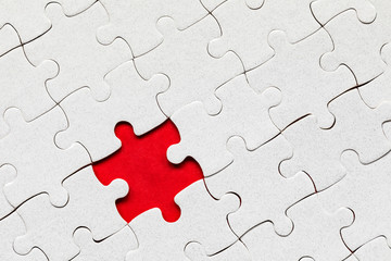 White jigsaw puzzle pieces. Fill in pieces of the jigsaw puzzle. Complete the jigsaw puzzle with...