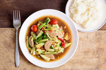 Spicy cucumber salad with steamed pork sausage and sticky rice, Thai food