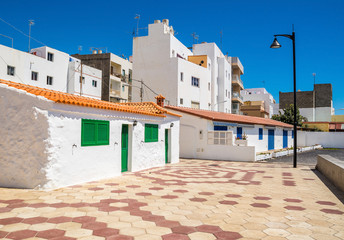 Tenerife. White houses on the street in Las Galletas, Tenerife, Canary Islands, Spain. Artistic...
