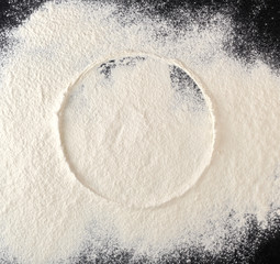 sprinkled white flour, round imprint from sieve