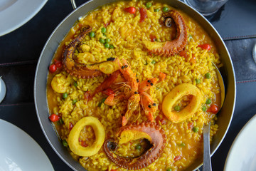 Seafood paella with fresh langoustine, clams, squid and octopus