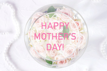 Obraz premium Greeting card with mother's day greetings and small roses.