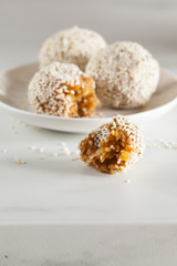 Healthy energy balls made of dried fruits and nuts with sesame. Raw vegan candy.