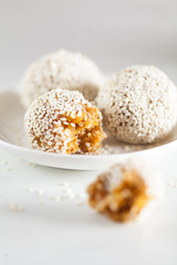Healthy energy balls made of dried fruits and nuts with sesame. Raw vegan candy.