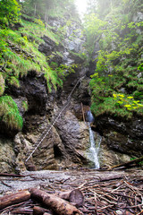 Metal ladders and waterfall in Slovak Paradise National Park