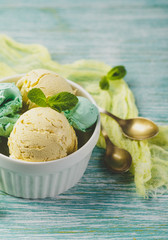 Ice cream with mint in ceramic bowl