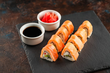 Japanese sushi on a rustic dark background.