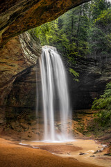 Ash Cave Falls - In the Hocking Hills of Ohio, a beautiful, tall, free-falling waterfall graces Ash Cave, an enormous recess cave with an overhanging cliff of Black Hand Sandstone.