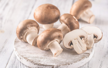 Champignon mushrooms on the wooden board