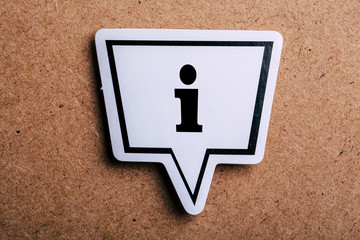 Information Sign Speech Bubble Isolated On Brown paper Background