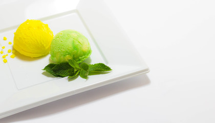 Set of ice cream scoops of different colors and flavours with fruits decoration isolated on white background 