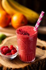 Delicious smoothie served on a wooden stump