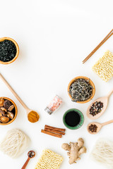 Chinese and Japanese food cooking with ginger, spices and noodles on white background top view mockup