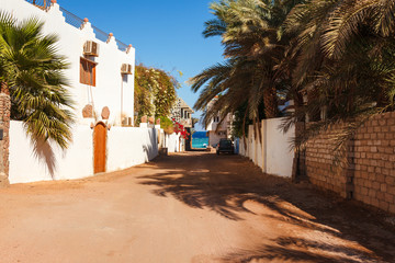 Street and coast of Red Sea in Dahab, Sinai, Egypt, Asia in summer hot. Famous tourist destination near of Sharm el Sheikh. Bright sunny light
