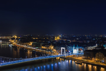 Fototapeta na wymiar Night view of Budapest. Cityscape of famous tourist destination with Danube and bridges. Travel illuminated landscape in Hungary, Europe.