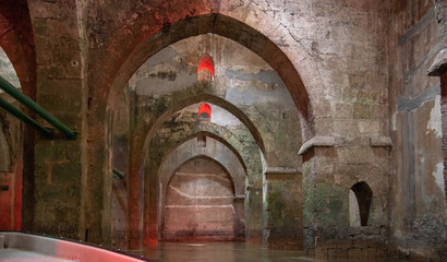 Fototapeta na wymiar The underground Pool of Arches in Ramla.Israel. Built during the reign of the caliph Haroun al-Rashid in 789 AD