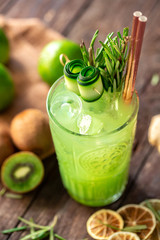 Refreshing ice cold smoothie made of lime, ginger and kiwi