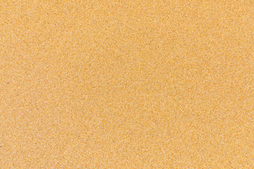 Fototapeta na wymiar Sand surface and background. Sand Texture. Brown sand. Background from fine sand. Sand background. Closeup of sand pattern of a beach in the summer.