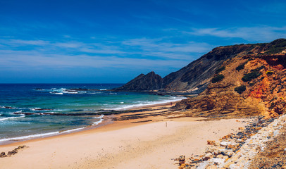 Wooden walkway to the beach Praia da Amoreira, District Aljezur, Algarve Portugal. Panorama from Amoreira beach in the Algarve Portugal. Beach and estuary of the Aljezur river, Praia da Amoreira.