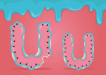 Whole and bitten delicious Latin letters U in the form of cookies with watermelon icing.