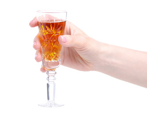 Cognac in a glass in hand on a white background. Isolation