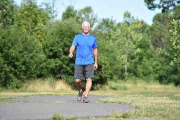Fototapeta premium Old Male Senior Smiling Wearing Sneakers Exercising