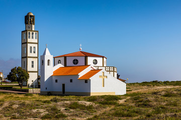 Fototapeta na wymiar Church at Costa Nova a famous beach near Aveiro Centro Portugal. Church in the popular tourist resort of Costa Nova, Aveiro, Portugal.