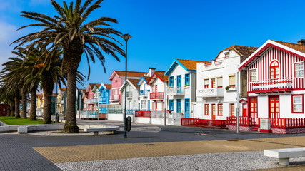 Street with colorful houses in Costa Nova, Aveiro, Portugal. Street with striped houses, Costa...