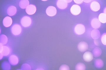 Blurred purple and blue sparkling festive bokeh background