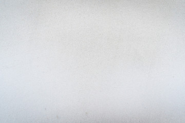 Texture of concrete wall surface painted with white color. Suitable for use as a pattern or background image for use in graphic design.