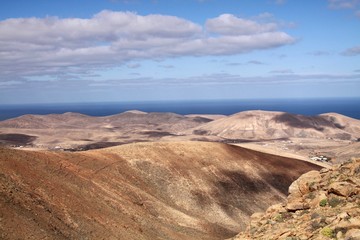 Fototapeta na wymiar Panoramic view over the mountains of Betancuria to Atlantic ocean, Fuerteventura, Canary Islands