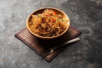 Chinese Bhel is a spicy indo-chinese recipe, served in a bowl. selective focus - obrazy, fototapety, plakaty