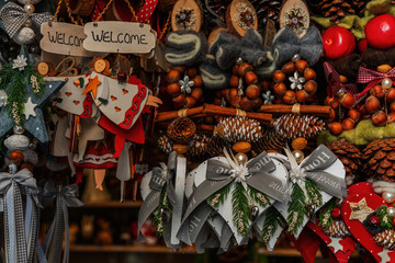 Typical shop selling souvenirs on traditional Christmas Market in historic center of Munich, Germany. Colorful Christmas background. Many different handmade souvenir. Selective focus.