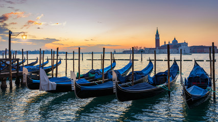 Naklejka premium Sunrise in San Marco square, Venice, Italy. Venice Grand Canal. Architecture and landmarks of Venice. Venice postcard with Venice gondolas