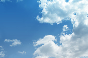 white fluffy clouds in the blue sky