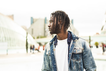 Obraz premium Outdoor portrait of a handsome young African with serious expression