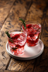 Gin raspberry cocktail with rosemary