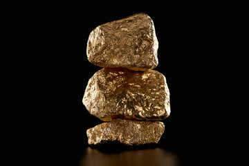 pile of gold textured shiny stones isolated on black