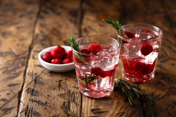 Gin raspberry cocktail with rosemary