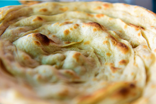 Lacha paratha, puff pastry. Traditional Indian flat bread paratha, close up.